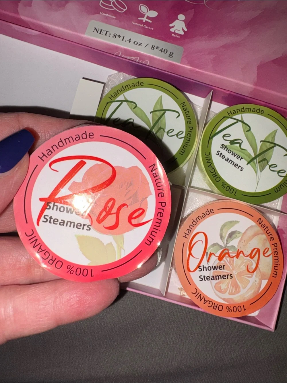 Shower steamers, 4 left, 2 tea tree, one orange, and one rose